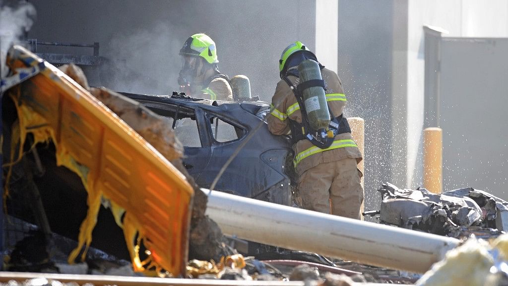 Emergency personnel work at the site of the crash in Melbourne. (Photo: AP)