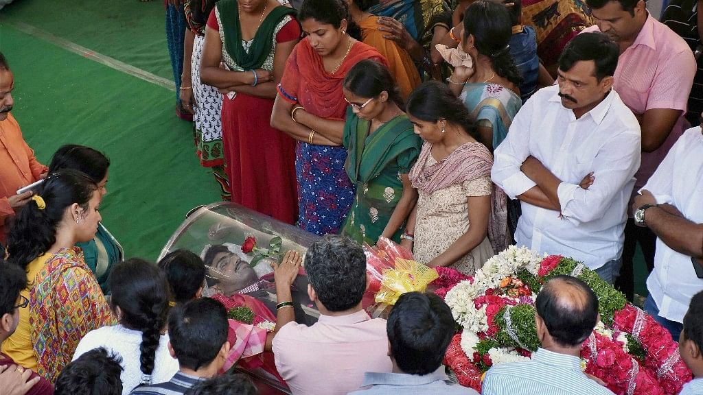 Family members and relatives near the mortal remains of Srinivas Kuchibhotla before his last rites in Hyderabad on Tuesday. (Photo Courtesy: PTI)