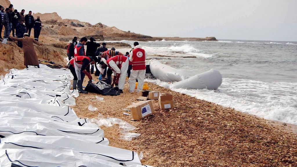 The Red Crescent published pictures of the bodies laid out in white and black body bags along the beach. (Photo: AP)