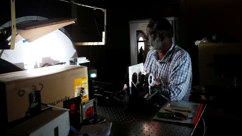 Devendran works inside the solar tunnel telescope. (Photo: Reuters)