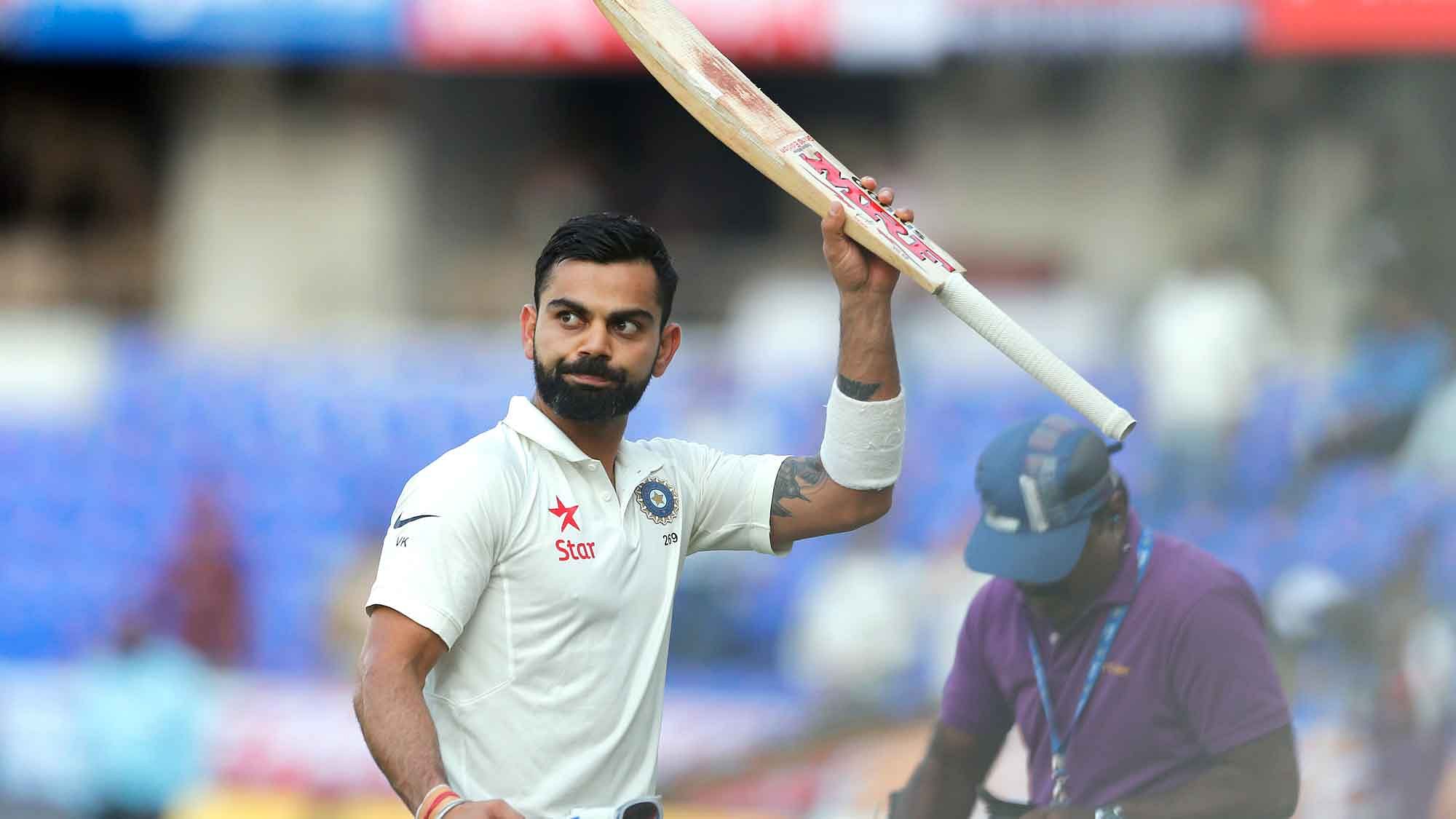 Virat Kohli waves at the crowd after losing his wicket for 204 on Day 2 of the Hyderabad Test. (Photo: BCCI)