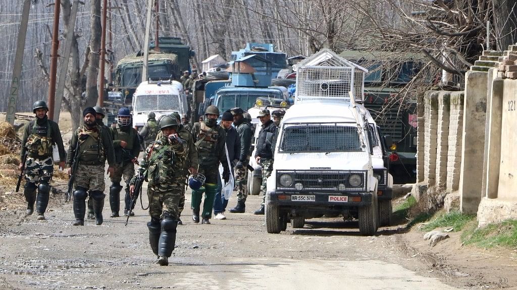 Soldiers in action during a gunfight between security forces and militants at Padgampora village in Jammu &amp; Kashmir’s Pulwama district. (Photo: IANS)
