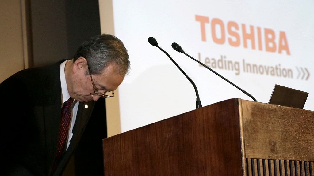 Toshiba Corp. President Satoshi Tsunakawa bows at a press conference in Tokyo. Toshiba said  it was considering selling its money-losing Westinghouse operations in the US. (Photo Courtesy: AP)