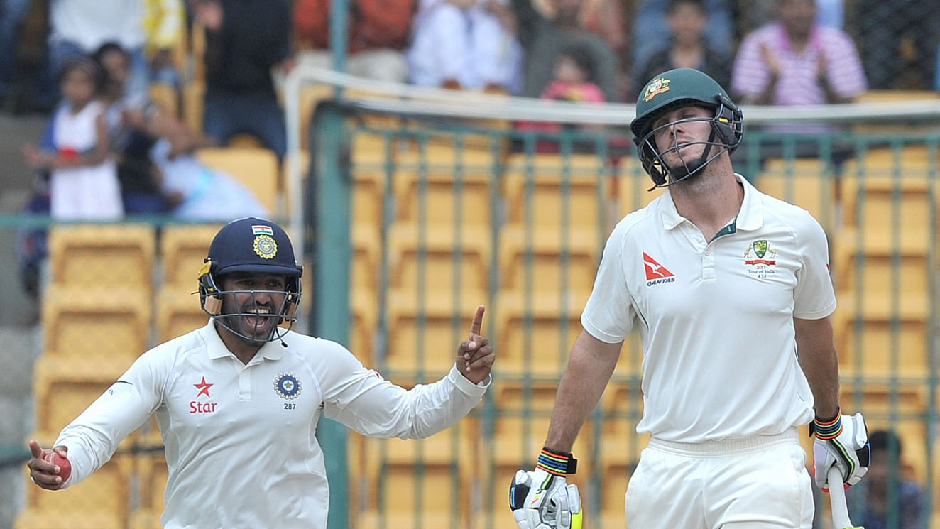  Karun Nair of India celebrate fall of Mitchell Marsh’s wicket during the fourth day of the second test match between India and Australia at M. Chinnaswamy Stadium in Bengaluru. (Photo: BCCI)