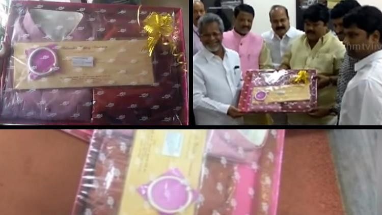 

The invitation from TRS MLC Sabavat Ramulu Naik  comes with a thick silver bangle and a ‘sherwani’. (Photo Courtesy: The News Minute)