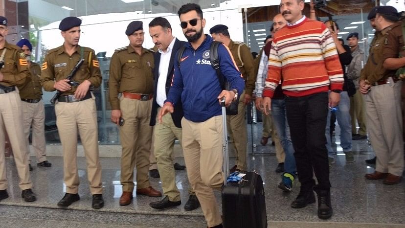 Virat Kohli arrives at the Kangra airport in Gaggal. (Photo: IANS)