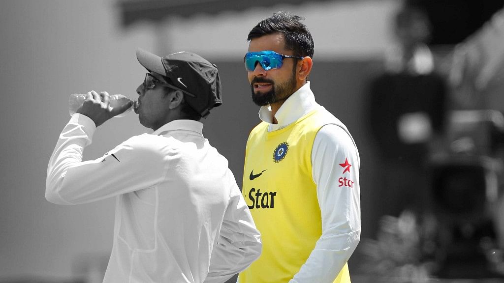 Virat Kohli is the 12th man in Dharamsala Test. (Photo: BCCI/Altered by <b>The Quint</b>)