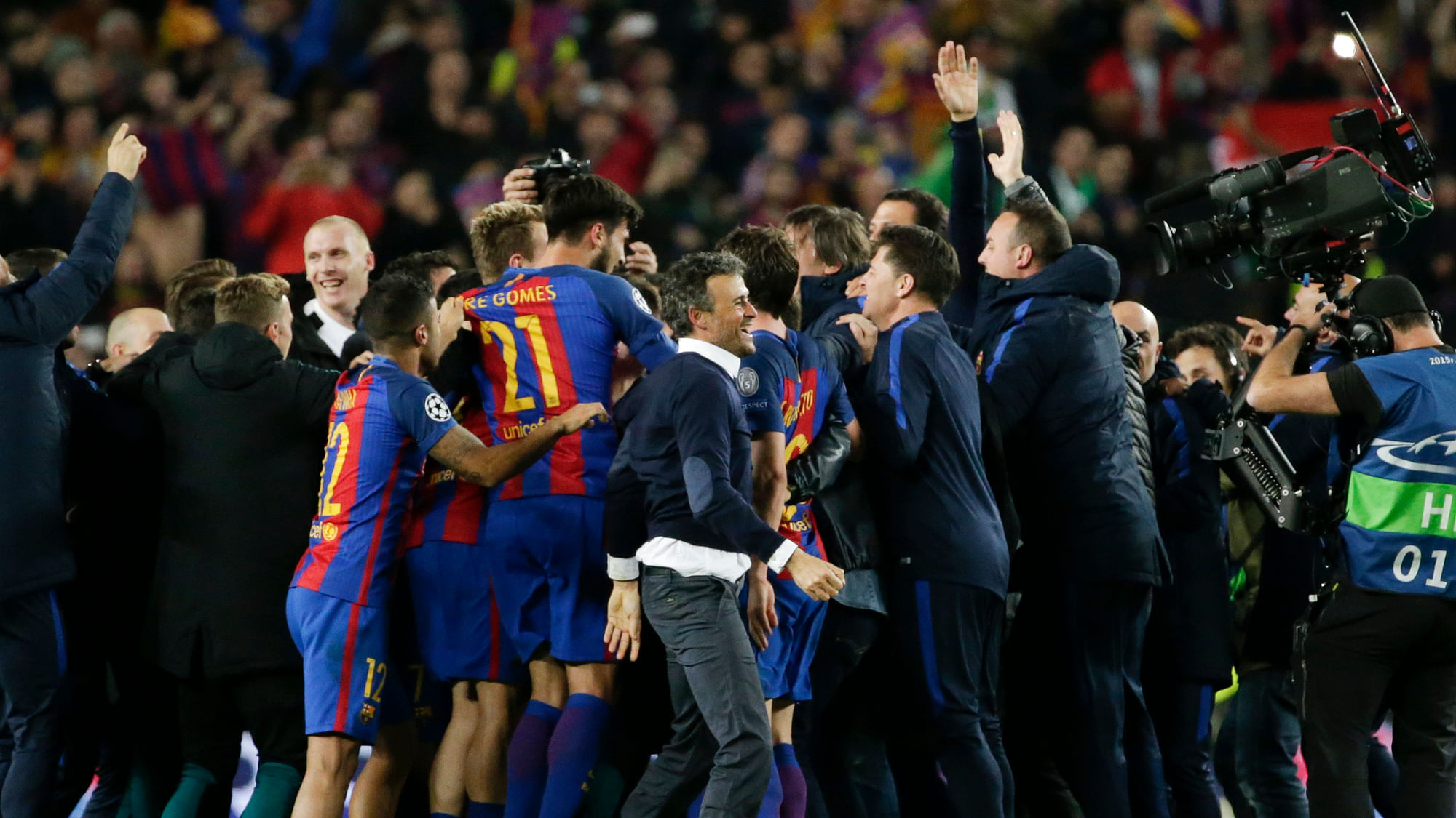 Barcelona’s head coach Luis Enrique, center, celebrates with players at the end of the Champions League round of 16, second leg soccer match between FC Barcelona and Paris Saint Germain. (Photo: AP)