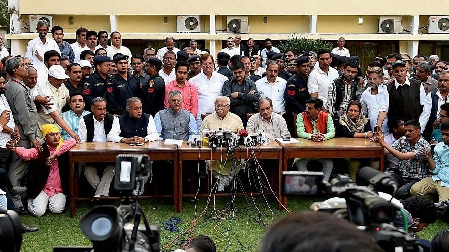 Haryana Chief Minister Manohar Lal Khattar and Union Ministers Ch Birender Singh and PP Chaudhary with Jat Leader Yashpal Malik. (Photo: PTI)