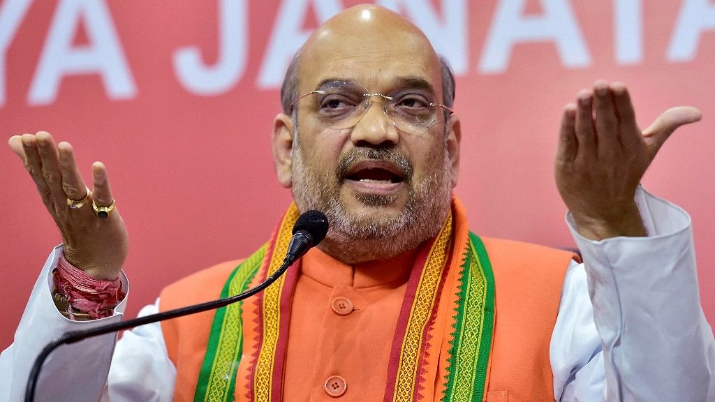 BJP Amit Shah addresses a gathering at the party headquarters in New Delhi, after the BJP’s win in the Assembly elections. (Photo: PTI) 