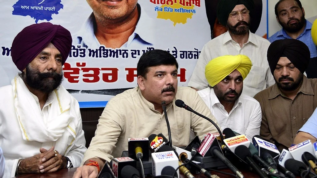 AAP leader Sanjay Singh (centre) addresses a press conference in Chandigarh on 6 September 2016. (Photo: IANS)