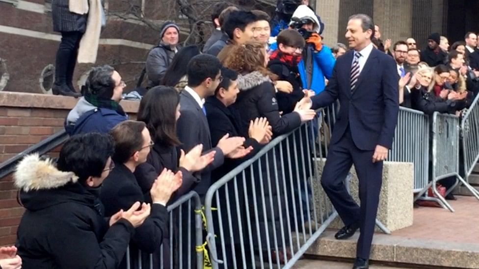 

In this image made from a video,Preet Bharara, walks down a line of applauding well-wishers  in front of the New York office, where he worked until he was fired. (Photo: AP)