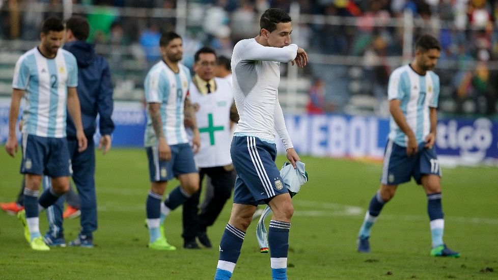 Argentina’s Angel Di Maria and his teammates are dejected after losing to Bolivia on Tuesday. (Photo: AP)