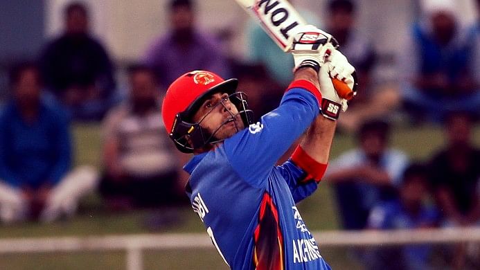 Afghanistan’s Mohammad Nabi hits a six during the first ODI against Ireland in Greater Noida on Wednesday. (Photo: AP)
