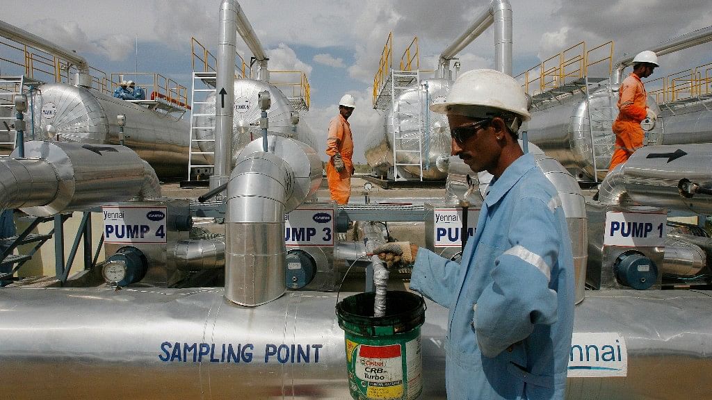 Cairn India employees work at a storage facility for crude oil at Mangala oil field at Barmer. (Photo: Reuters)