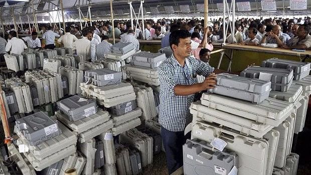 

Polling officials collecting Electronic Voting Machines. (Photo: PTI)