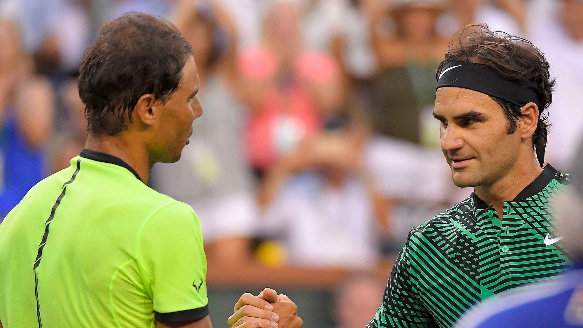 File photo of Rafael Nadal (L) and Roger Federer (R).