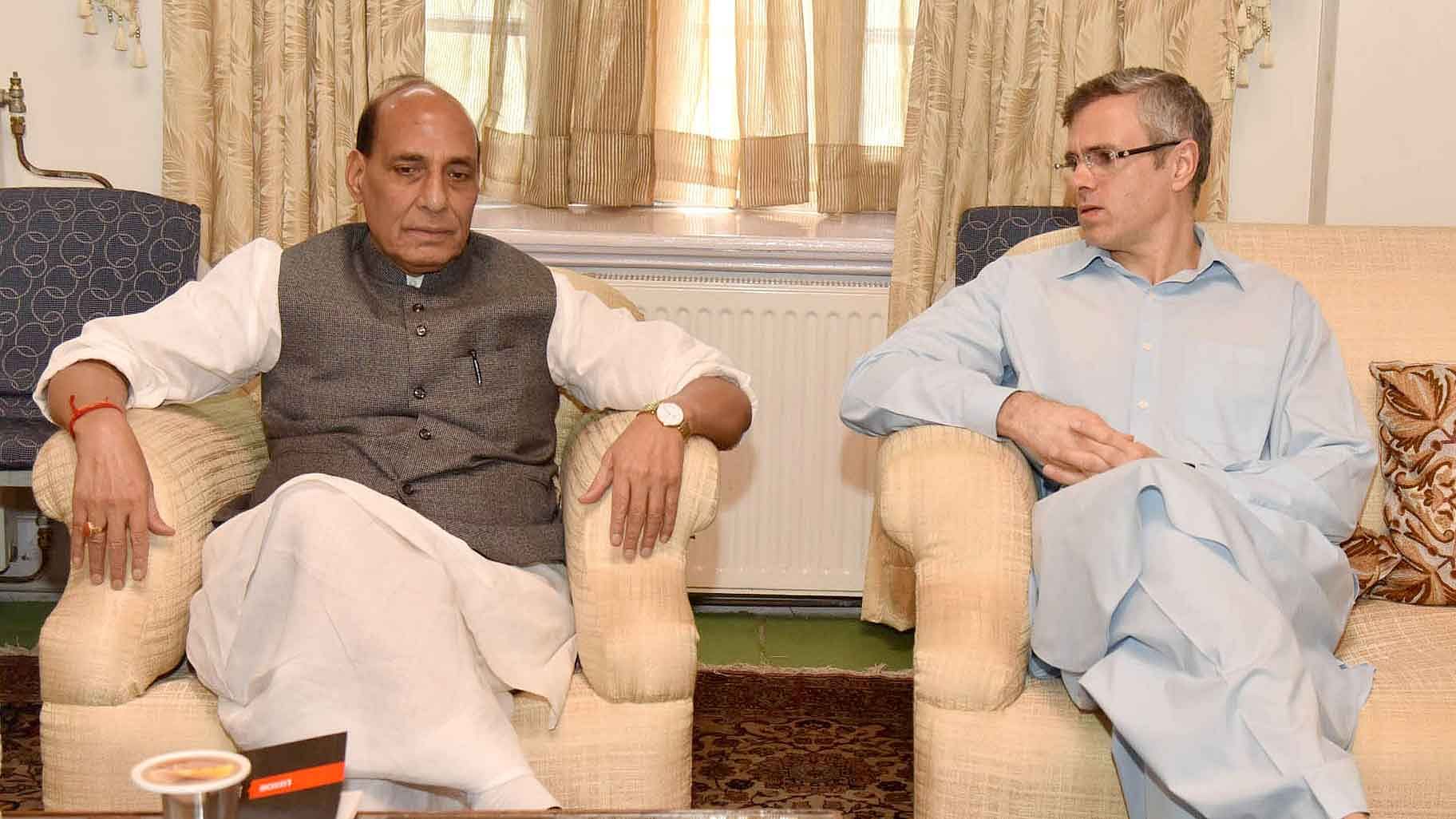 File picture of former Jammu and Kashmir chief minister Omar Abdullah with Union Home Minister Rajnath Singh in Srinagar. (Photo: IANS)