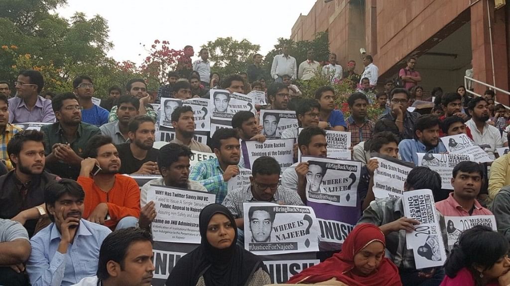 Students outside JNU’s administrative block gather in support of missing student Najeeb Ahmed. (Photo: <b>The Quint</b>)