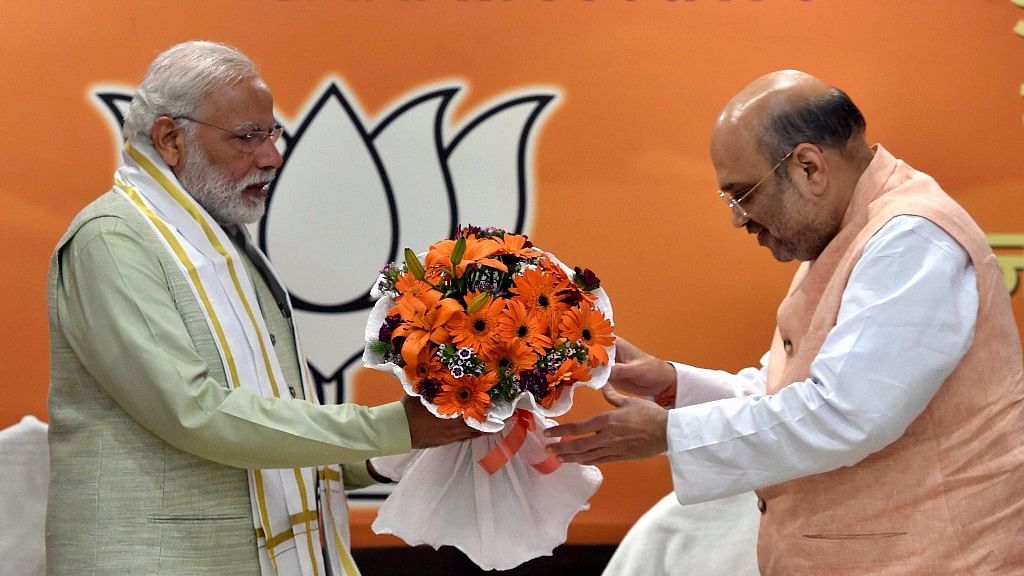 Amit Shah felicitates PM Narendra Modi on Sunday. (Photo: PTI)