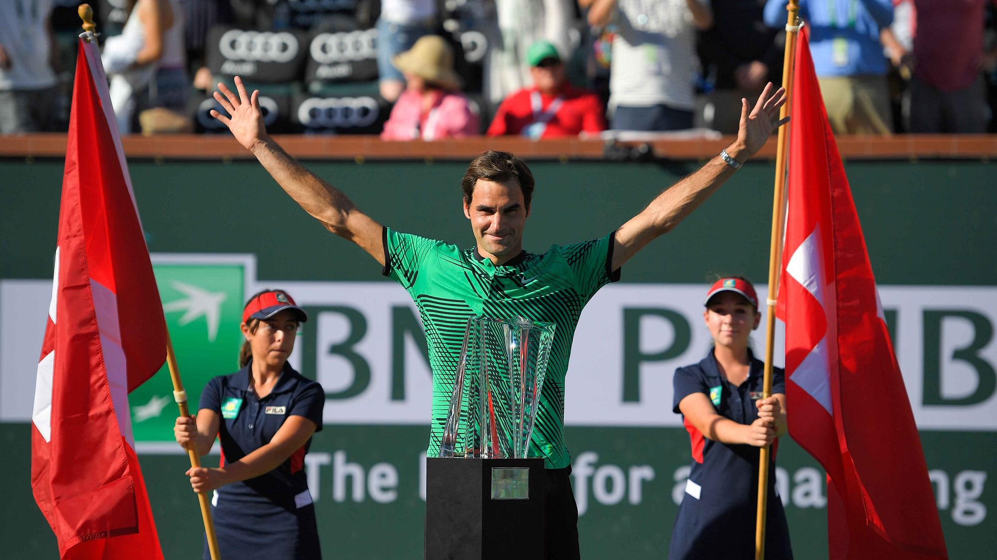 Roger Federer, of Switzerland, poses with the trophy after his win against Stanislas Wawrinka, of Switzerland, in the finals of the BNP Paribas Open. (Photo: AP)