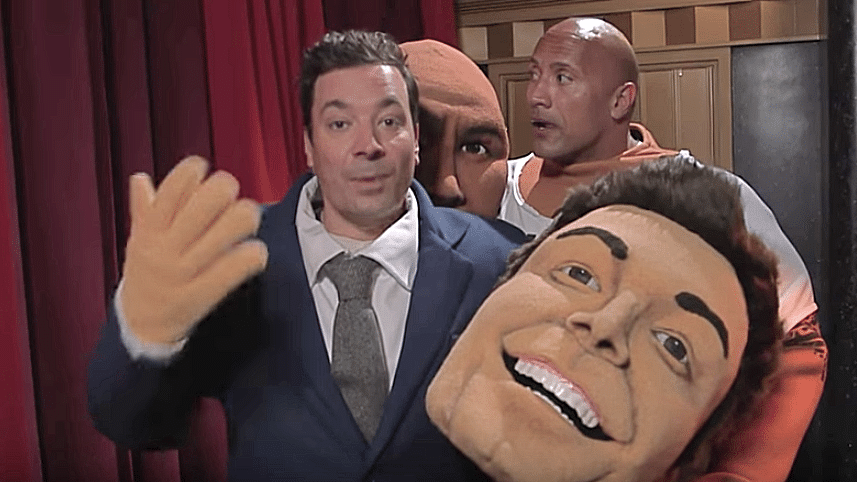 Dwayne Johnson and Jimmy Falon can’t get enough of the photobombing game. (Photo courtesy: YouTube/<a href="https://www.youtube.com/channel/UC8-Th83bH_thdKZDJCrn88g">The Tonight Show Starring Jimmy Fallon</a>)