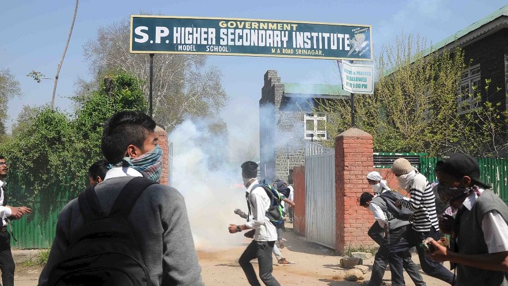 Students in Srinagar, trying to negate the tear gas used by the police forces (Photo Courtesy: Muneeb ul-Islam)