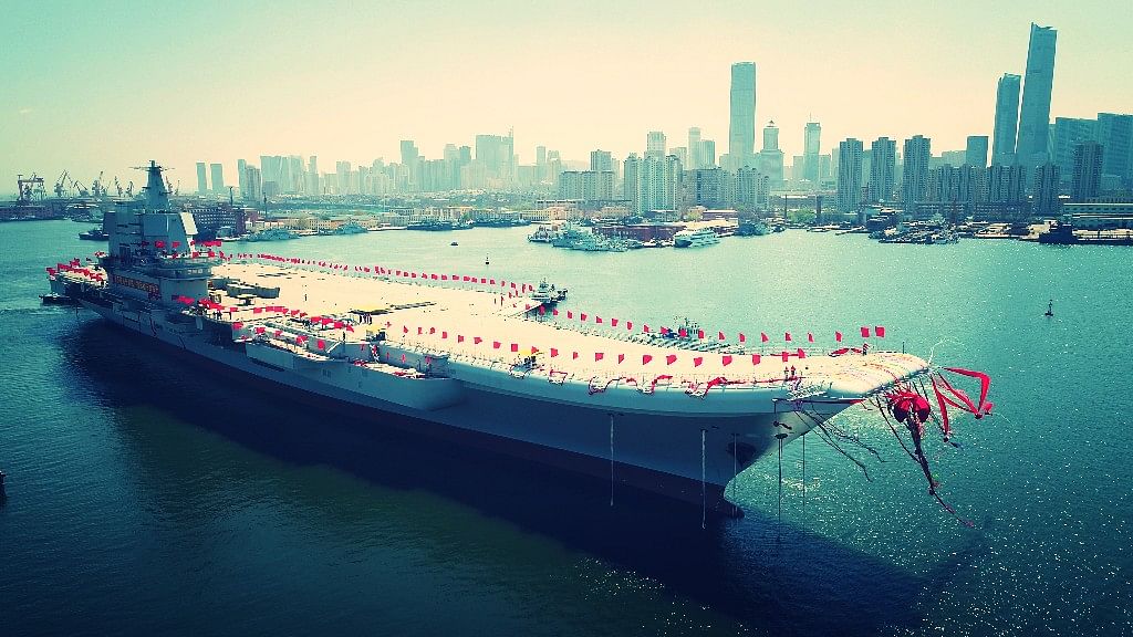 In this photo released by China’s Xinhua News Agency, a newly-built aircraft carrier is transferred from dry dock into the water at a launch ceremony at a shipyard in Dalian in northeastern China’s Liaoning Province, Wednesday, 26 April 2017. (Photo: AP)