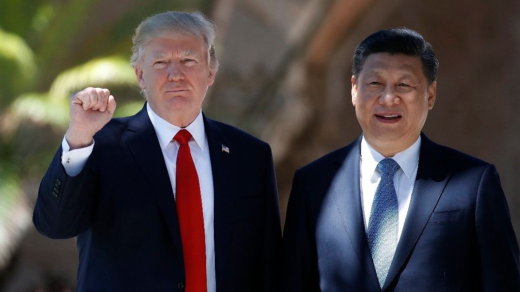 President Donald Trump (left) and Chinese President Xi Jinping pose for photographs at Mar-a-Lago.&nbsp;