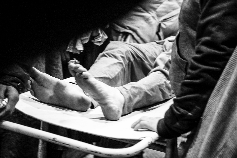 An Injured youth is
rushed to emergency at a hospital in Srinagar. (Photo: Hashim Hakeem)