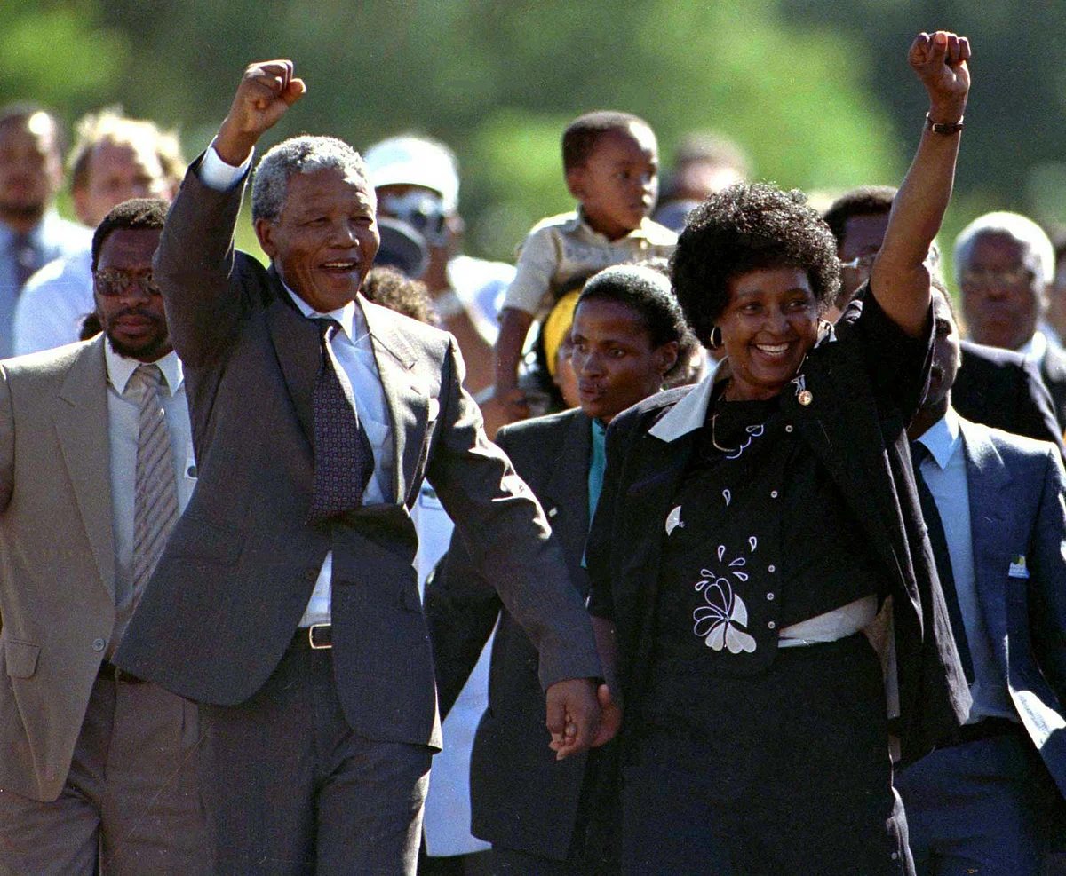 Nelson Mandela, accompanied by his wife Winnie, walks out of the Victor Verster prison near Cape Town after spending 27 years in jail. (Photo: Reuters)