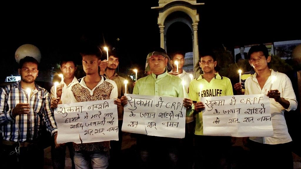 LJP activists take part in a candlelight vigil to pray for CRPF jawans lost their lives in a Naxal attack in Chhattisgarh’s Sukma district, in Patna on Monday. (Photo: PTI)