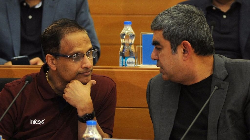 Infosys COO Pravin Rao (left) talking to CEO Vishal Sikka (right) (Photo: IANS)