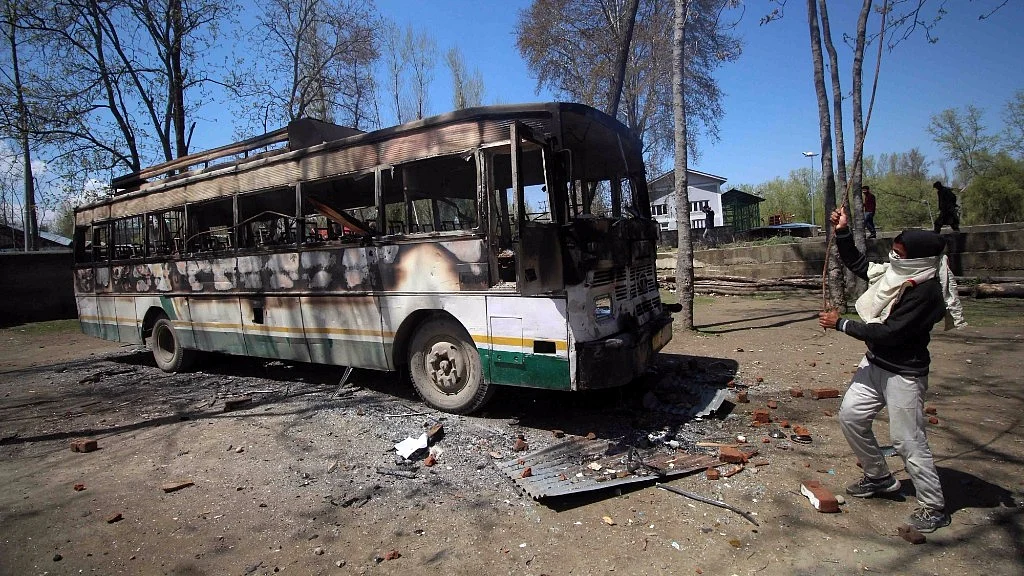 Remains of the bus that was set ablaze by protesters in Budgam during byelection for the Srinagar-Budgam parliamentary seat on 9 April 2017. (Photo: IANS)