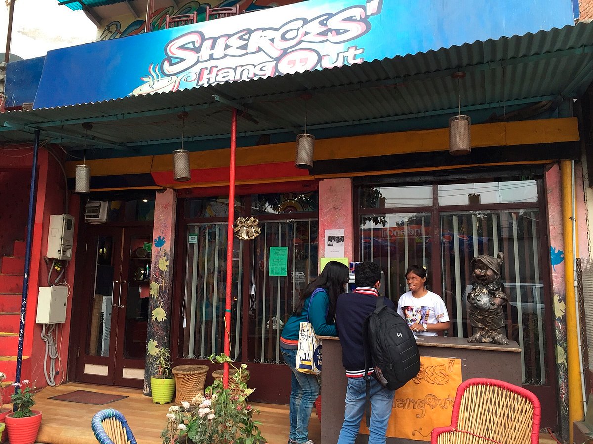 An acid attack survivor helps customers at Sheroes Hangout in Agra, India. An American woman traveling alone across India had come to the country to look at gender issues in this complex culture, but she often found she was as much an object of curiosity to locals as they were to her. (Kristi Eaton via AP)<a></a>