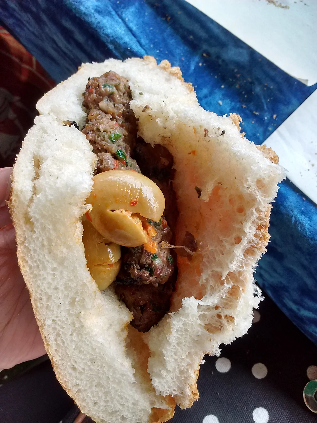 Locals like to make a sandwich of their kebabs and garnish it with pickled olives. (Photo: Suktara Ghosh)