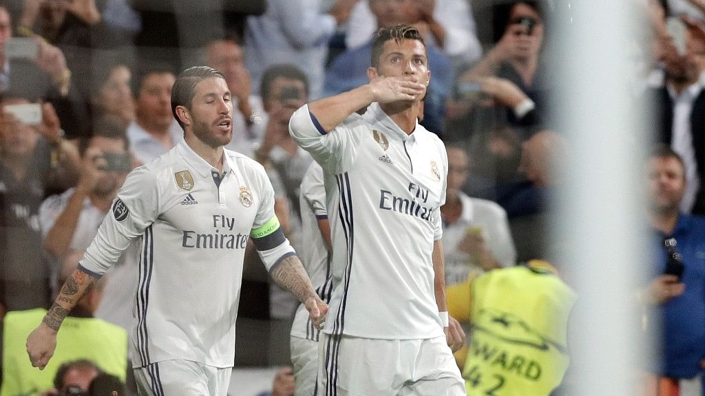Real Madrid’s Cristiano Ronaldo, right, celebrates after scoring his side’s first goal during the Champions League quarterfinal second leg soccer match between Real Madrid and Bayern Munich. (Photo: AP)&nbsp;