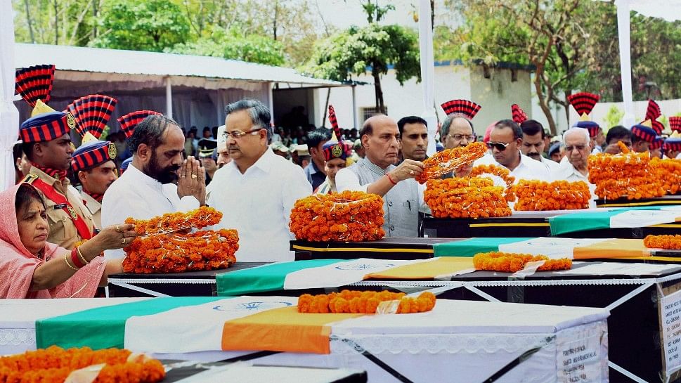 

 Union Home Minister Rajnath Singh pays tribute to CRPF jawans killed in the naxal attack in Chhattisgarhs Sukma district along with Chhattisgarh Chief Minister Raman Singh and Minister of State for Home Affairs Hansraj Gangaram Ahir. (Photo: PTI)