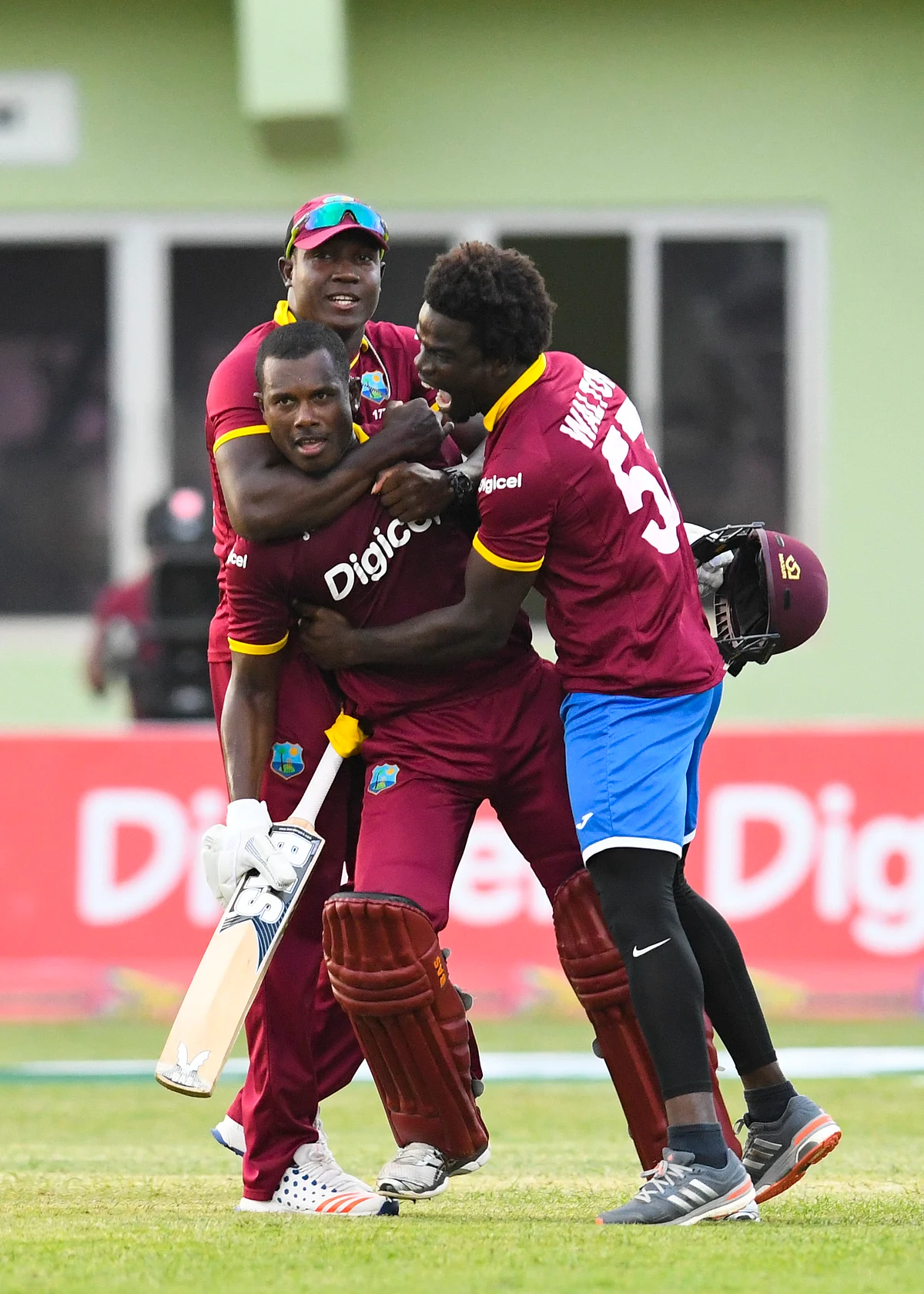 Teammates hug Mohammed after he gets them past the finish line. (Photo: WICB)