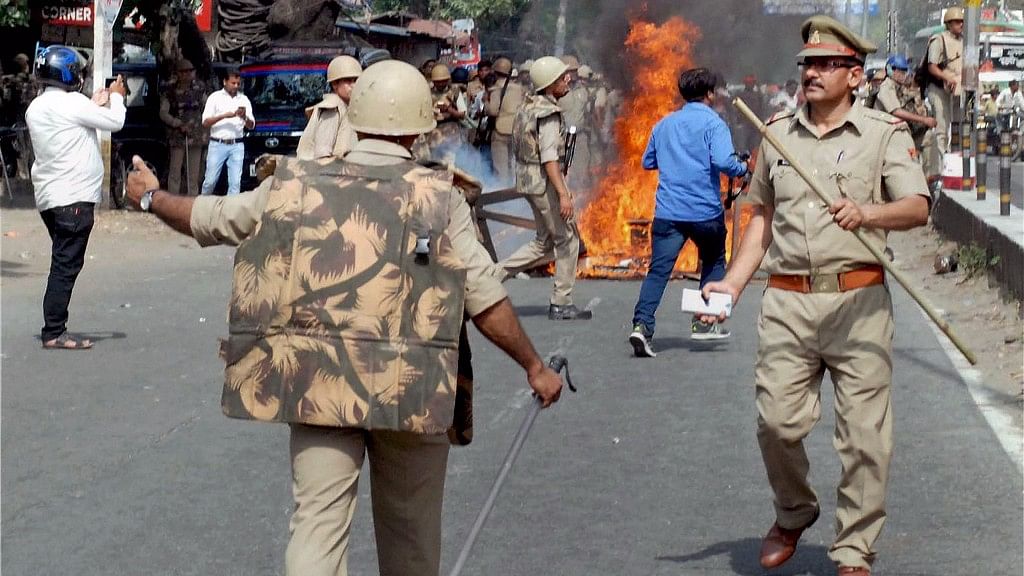 Police in action after violence broke out during an Ambedkar Jayanti Shobha Yatra in Saharanpur. (Photo: PTI)