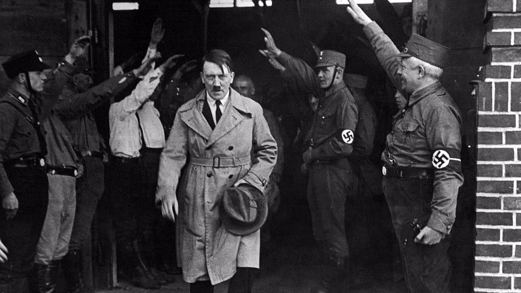 

Adolf Hitler,  saluted as he leaves the Nazi party’s Munich headquarters. (Photo: AP)