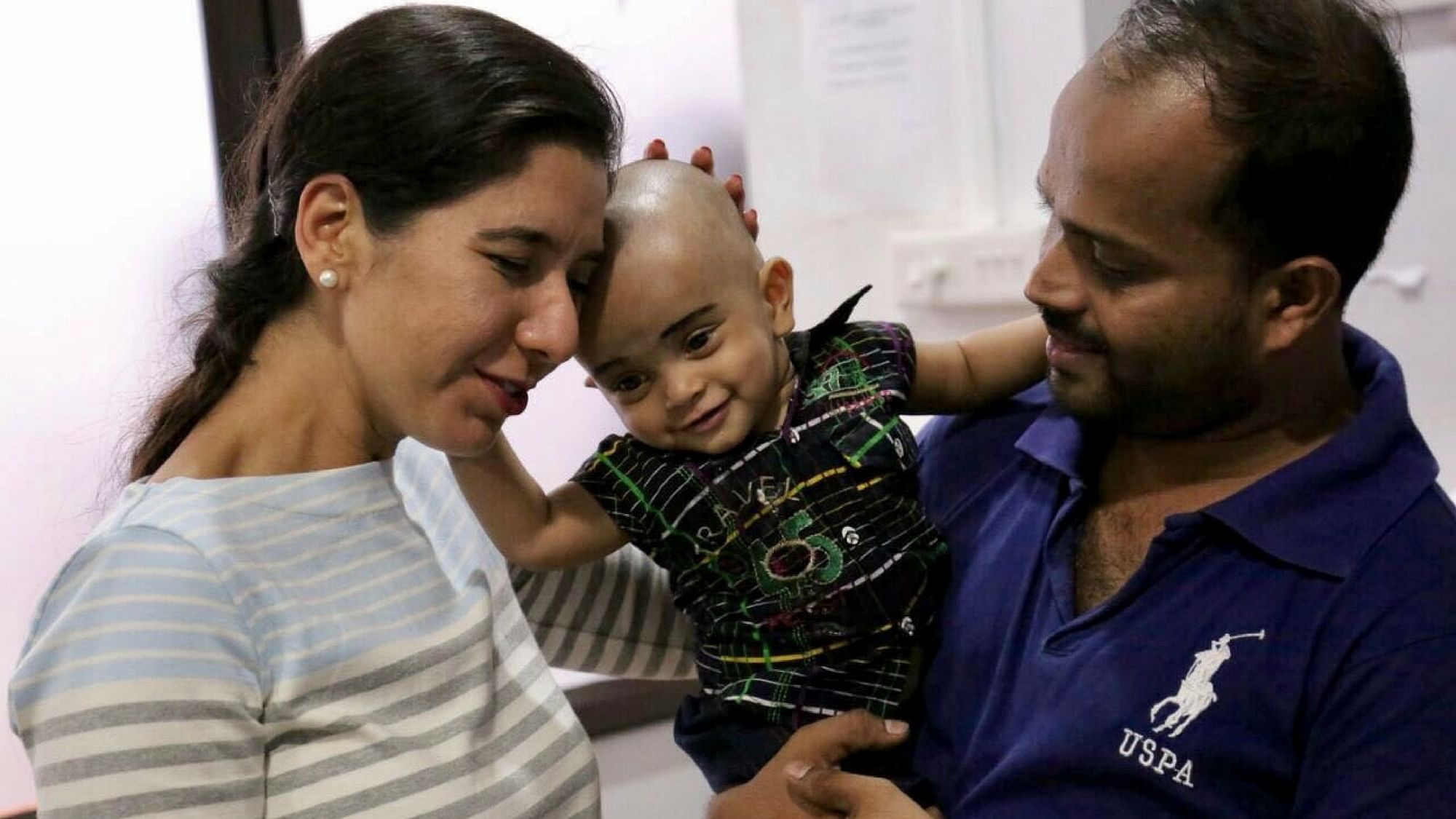 Md. Najwan, one of three sons of an auto driver, was operated on at the age of 6 months. This affectionate little boy from Malapuram district, is now 10 months old and well on his way to recovery. (Photo: <b>The Quint</b>)