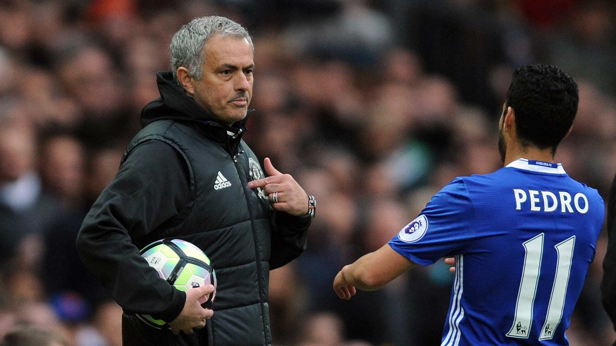 Manchester United’s team manager Jose Mourinho, left, talks to Chelsea’s Pedro during the English Premier League match between Manchester United and Chelsea at Old Trafford. (Photo: AP)