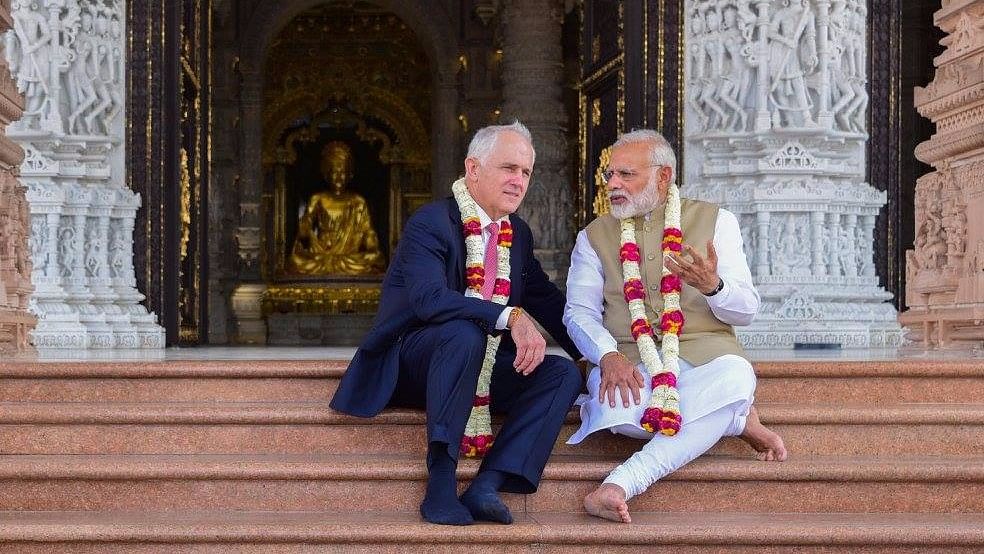Photos of Modi and Turnbull wearing garlands at the Akshardham temple triggered a flood of jokes and memes. (Photo Courtesy: Twitter)