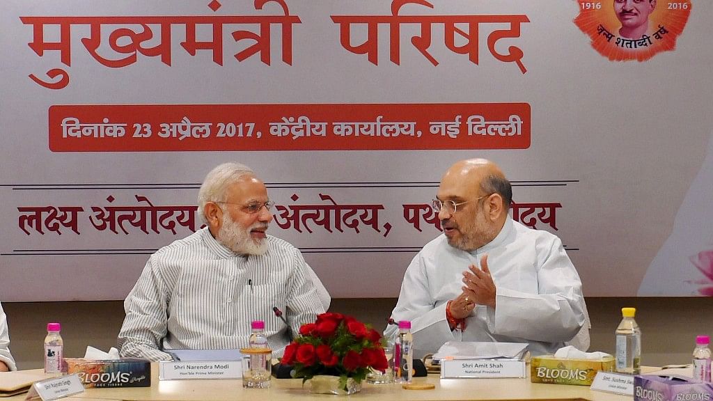 Prime Minister Narendra Modi with BJP President Amit Shah during a meeting with BJP chief ministers at party office in New Delhi on Sunday. (Photo: PTI)