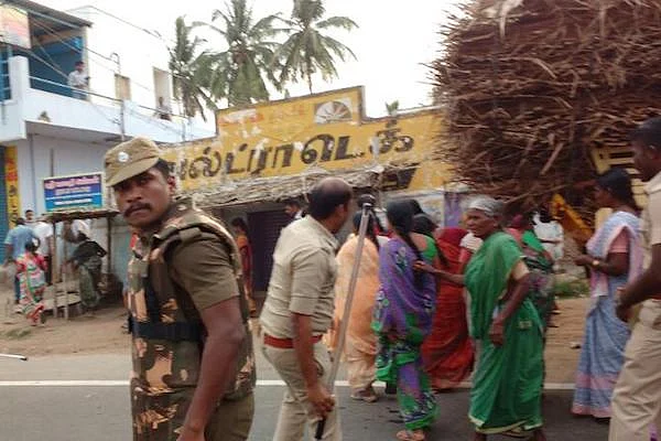 The incident happened as women were marching on the road in Samalapuram against a liquor shop being relocated to the area. (Photo Courtesy: The News Minute)