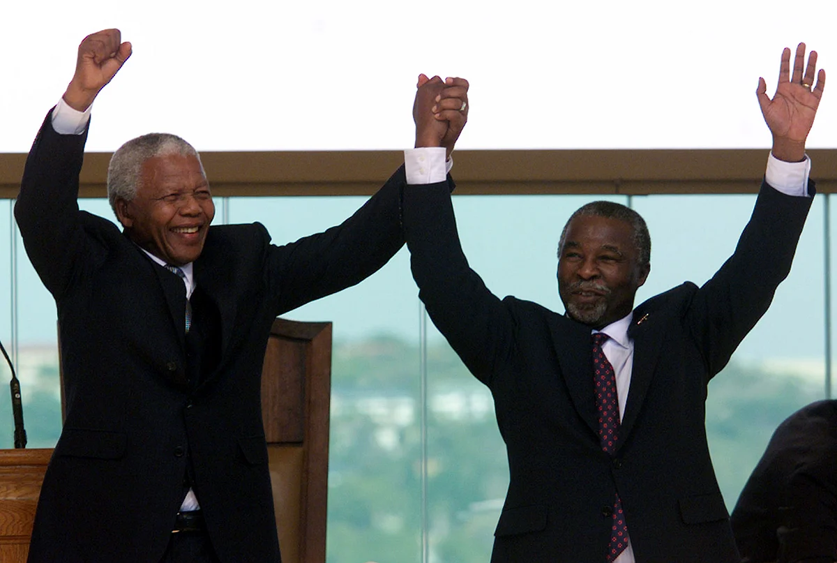 Mandela confided in the author all the details in his Johannesburg bungalow after he had handed over the Presidency to his successor, Thabo Mbeki (right). (Photo: Reuters)