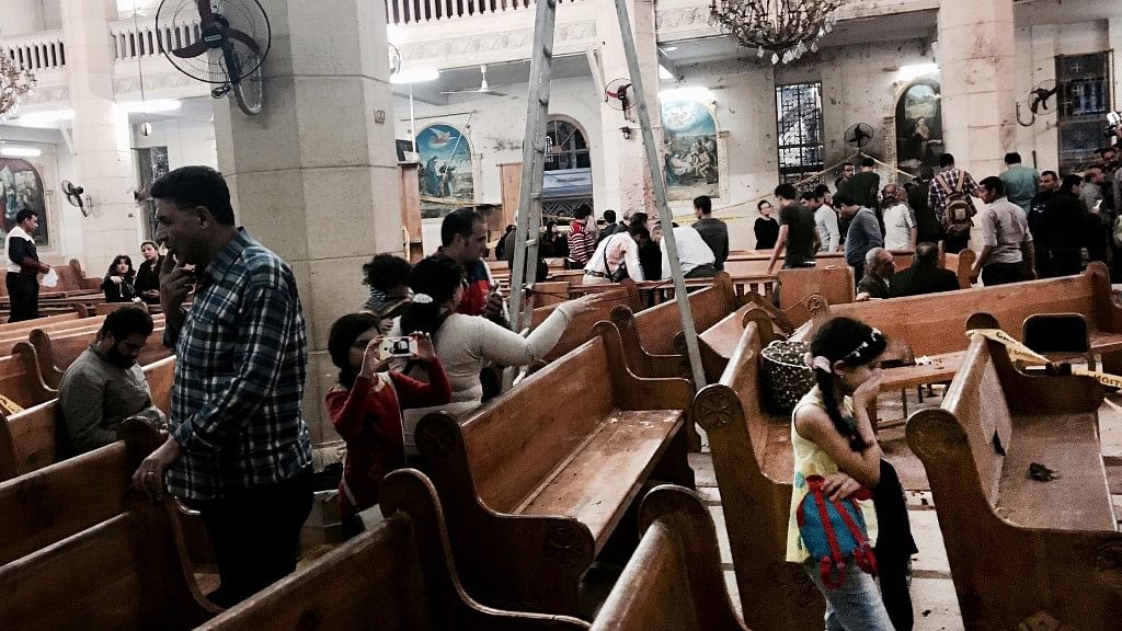 People look at damage inside the St. George’s after a suicide bombing, in the Nile Delta town of Tanta, Egypt on Sunday. (Photo Courtesy: AP)
