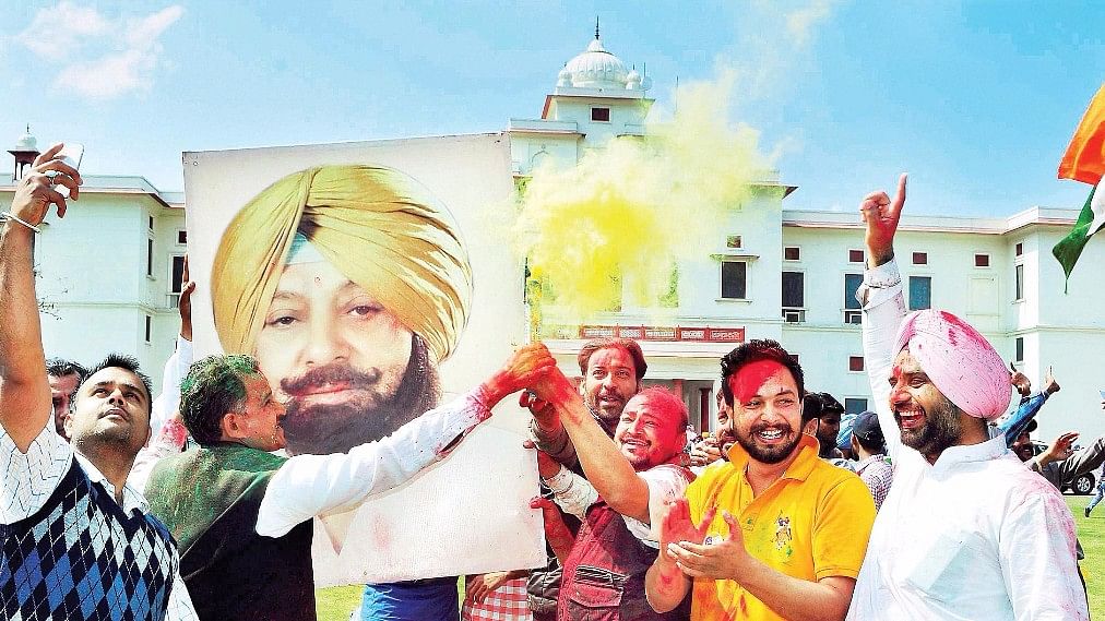 

People celebrate Captain Amarinder Singh’s victory in the Punjab Assembly elections in March. (Photo: PTI)
