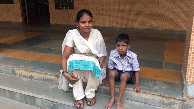 A child with special needs sits next to his mother in the municipal school he attends in Parel, central Mumbai. (Photo Courtesy: IndiaSpend/Swagata Yadavar)
